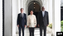 Philippines' President Ferdinand Marcos Jr. (C) greets US Secretary of State Antony Blinken (L) and US Secretary of Defense Lloyd Austin during a courtesy visit at the Malacanang Palace in Manila on July 30, 2024.