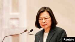 FILE PHOTO: Taiwan President Tsai Ing-wen speaks during a news conference with the incoming Taiwan Premier Chen Chien-jen and outgoing Taiwan Premier Su Tseng-chang, in Taipei