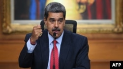 Venezuelan President Nicolas Maduro gestures during a press conference to the international media about the presidential election at the Miraflores presidential palace in Caracas on July 31, 2024.